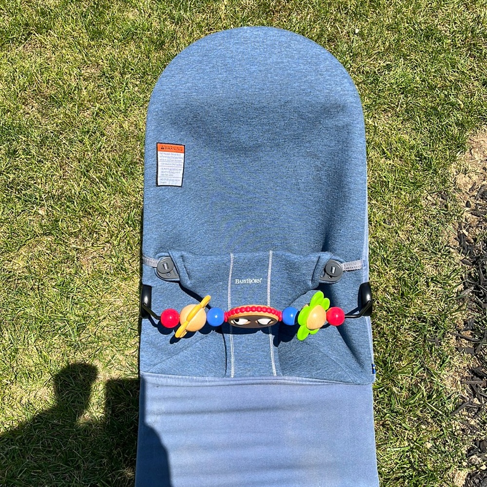 Baby Bjorne bouncer with blue cover and toy